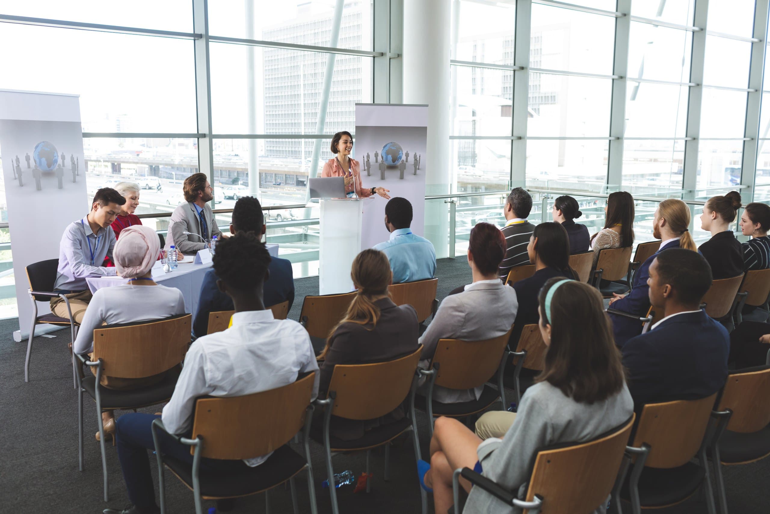 Audience listening to a speaker at a training event